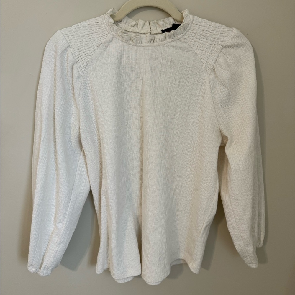Cream Anthropologie Blouse with ruffle neck